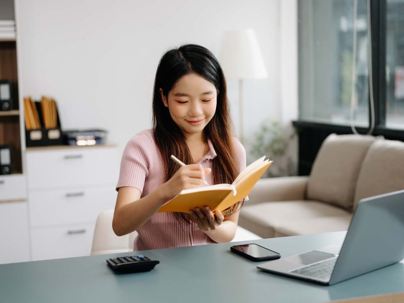 female-students-note-from-the-books-at-the-asian-g-RQRZFK4.jpg
