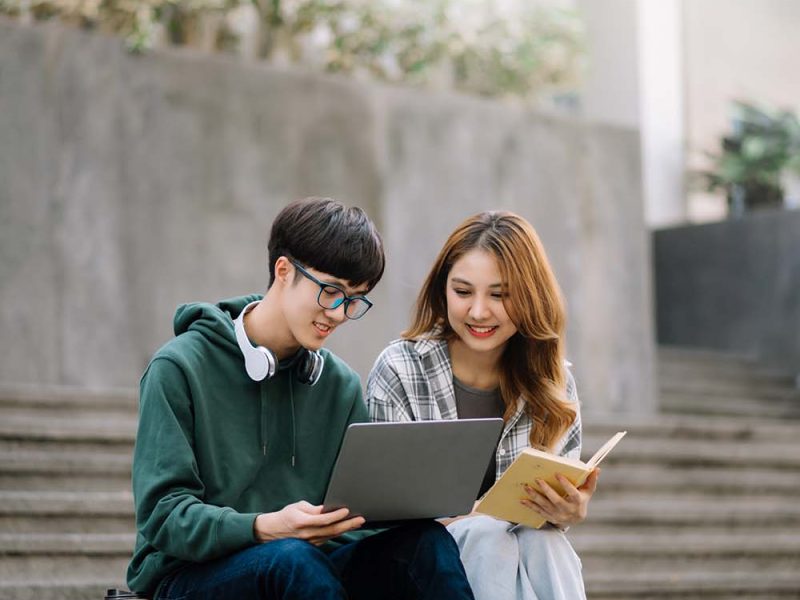 two-smart-young-asian-college-students-focusing-on-S7PPAGC.jpg